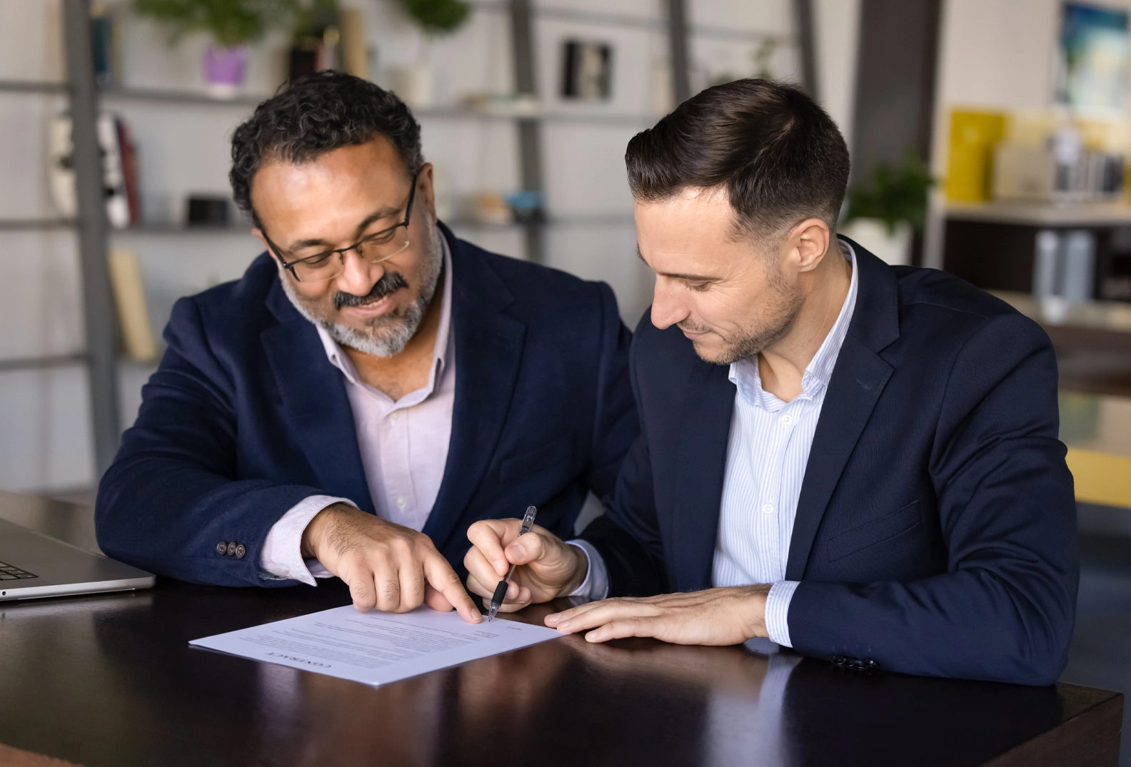 Two men reviewing paperwork