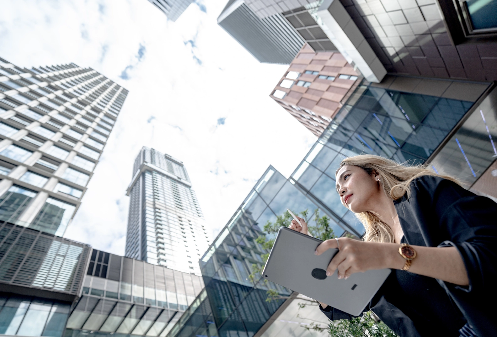 Woman standing outside with an iPad