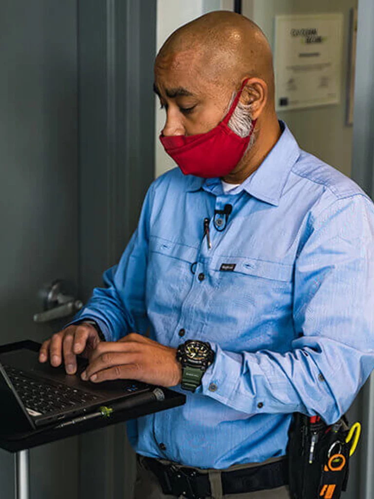 IT professional using a laptop