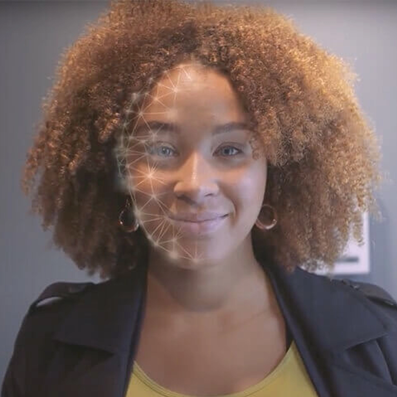 Woman with graphic overlay to indicate facial ID technology
