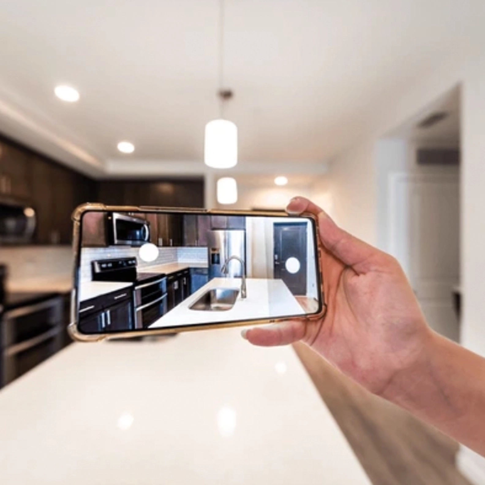 Someone taking a photo of a suite with their phone